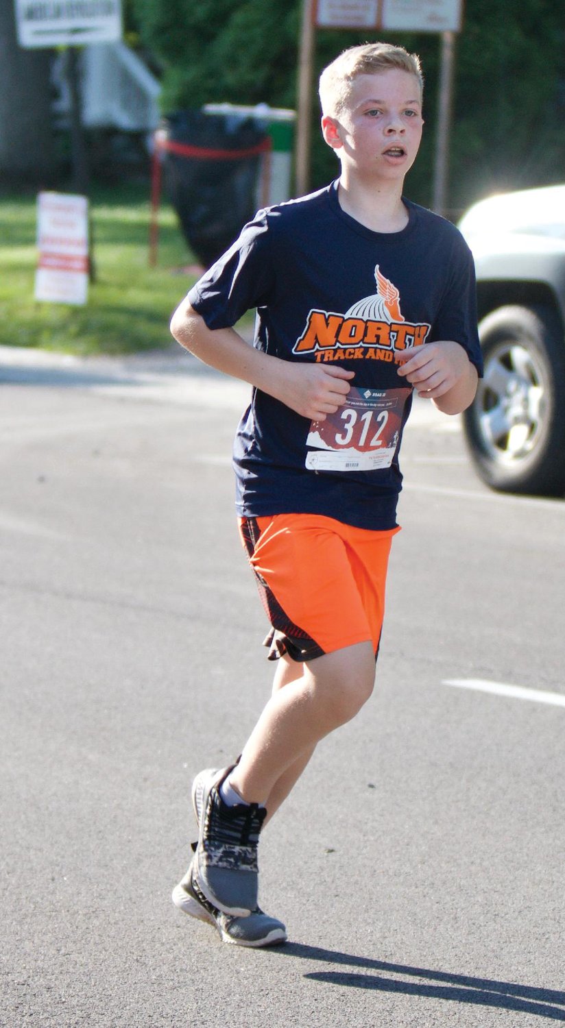 Tyler Thompson strides out during the 5K